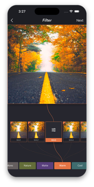 The PhoSplit filter screen with a Warm preset applied to an autumn road photo and a row of filter thumbnails grouped by category